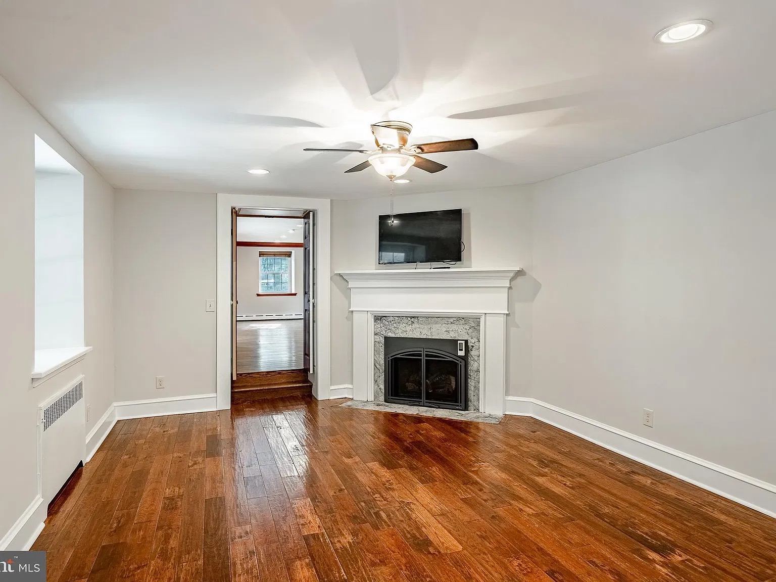 Living room with fireplace and television