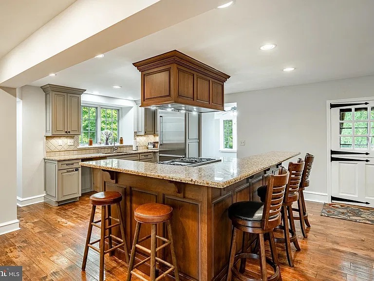 Kitchen with island and bar stools