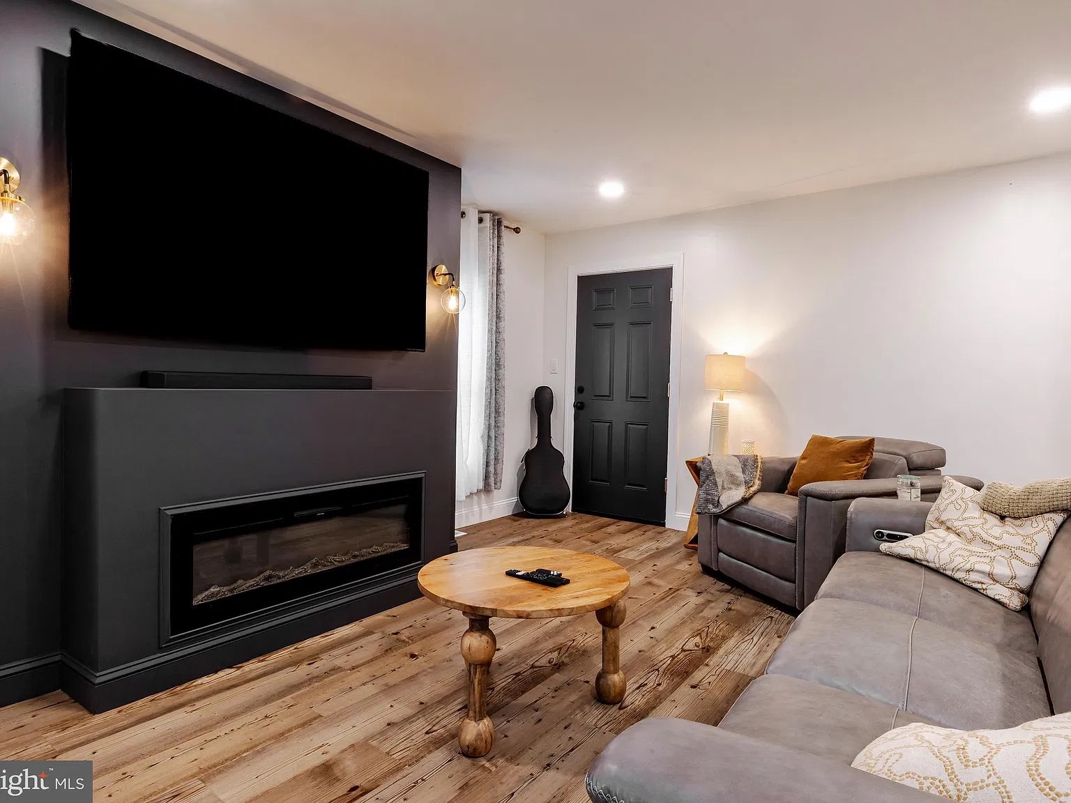 Living room with fireplace and television